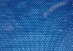 BACHE A BULLES PISCINE BOIS DAKOTA BORDEE 4 COTES